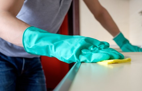Professional cleaners maintaining shared office areas in TW13